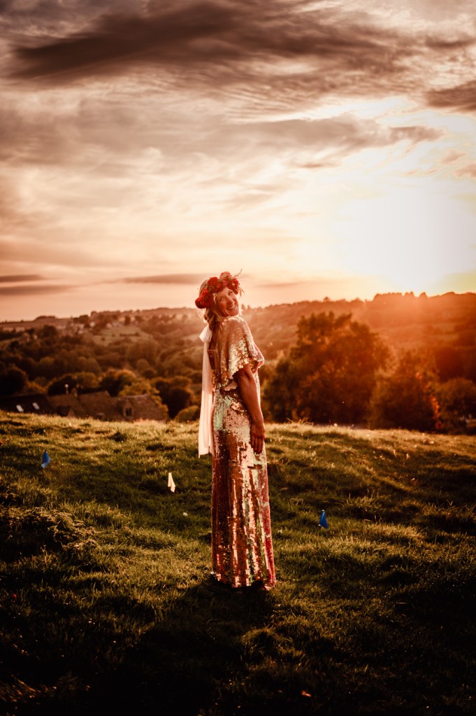bride in sparkle dress  at sunset dramatic countryside views