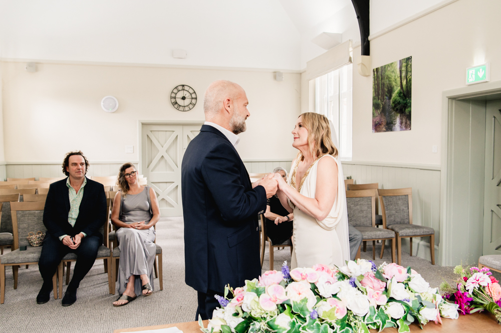 bride and groom holding hands old victorian school stroud