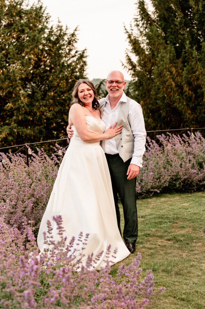 older bride and groom in english summer garden wedding