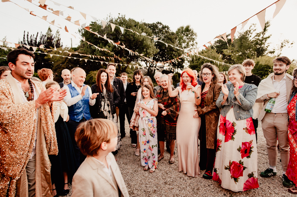 guests clapping festival wedding uk