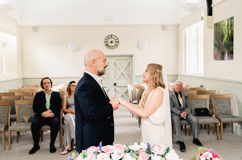 bride and groom holding hands stroud registry office wedding