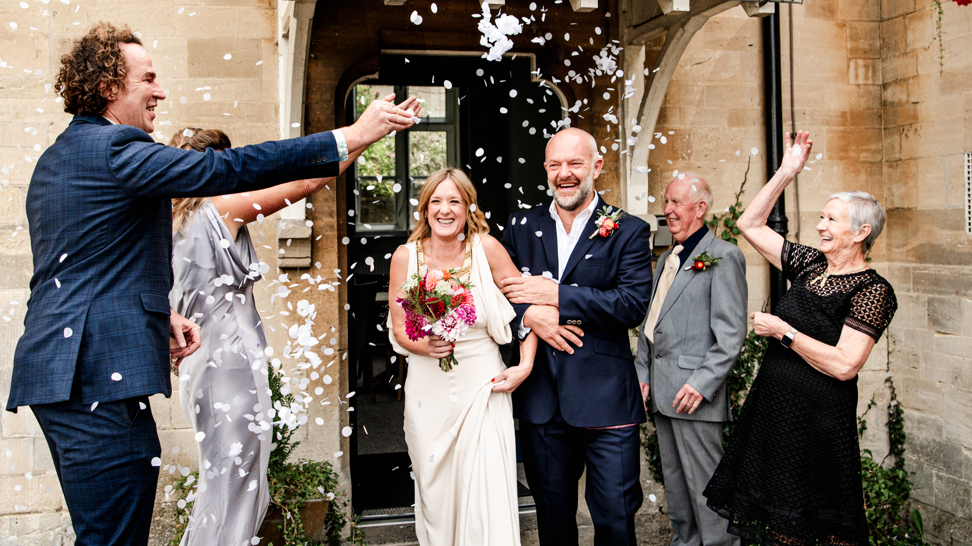 bride and groom walking out of stroud registry office
