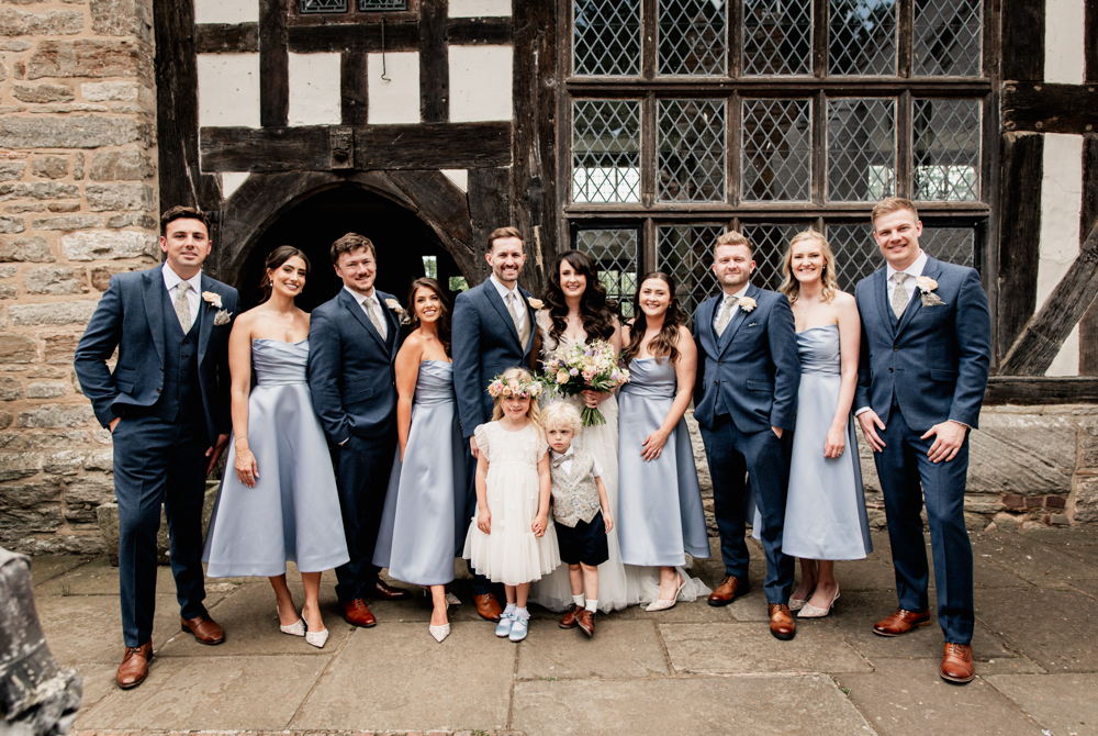 group photo in front of castle wedding
