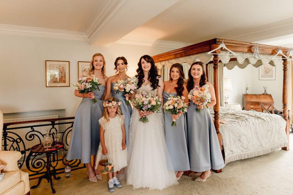 bride and bridesmaids in blue