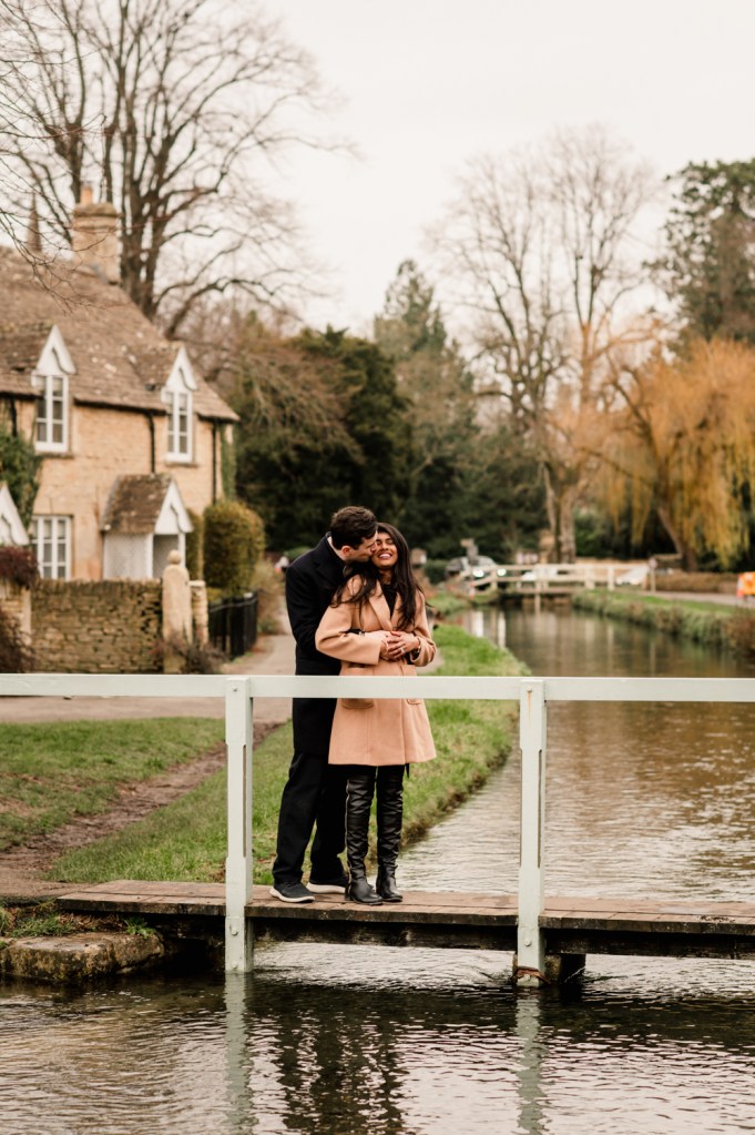 couple on a cotswold bridge