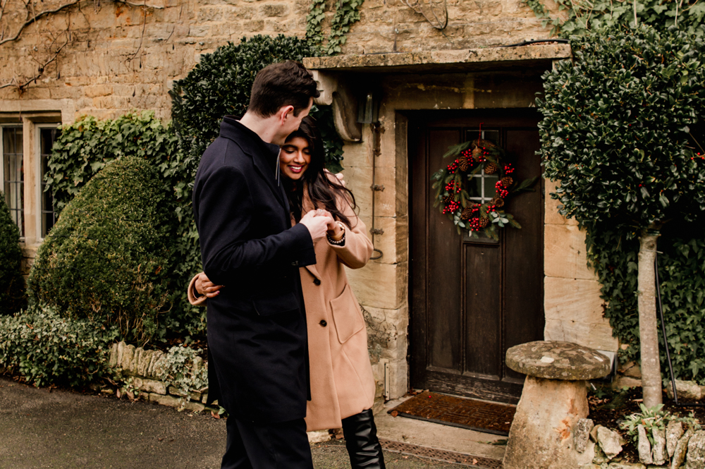 couple in a cute cotswold village