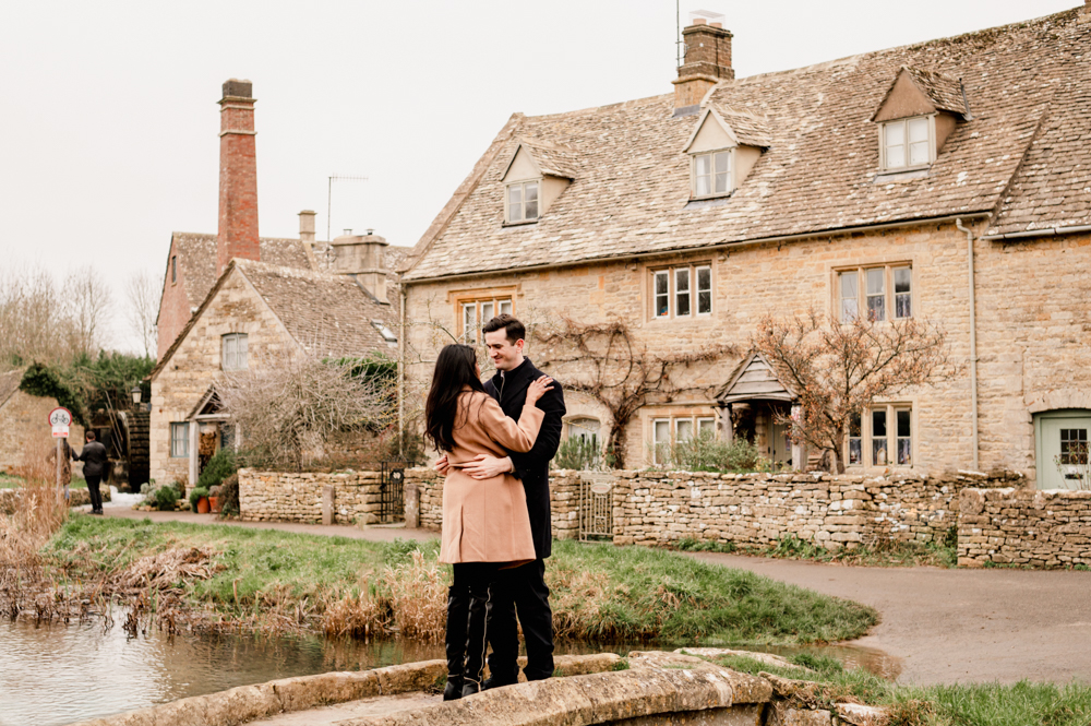 engaged couple in a cotswold village