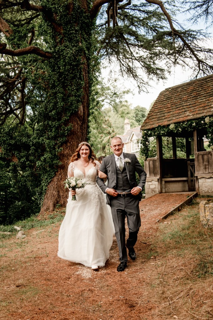 bride and father walking to the church