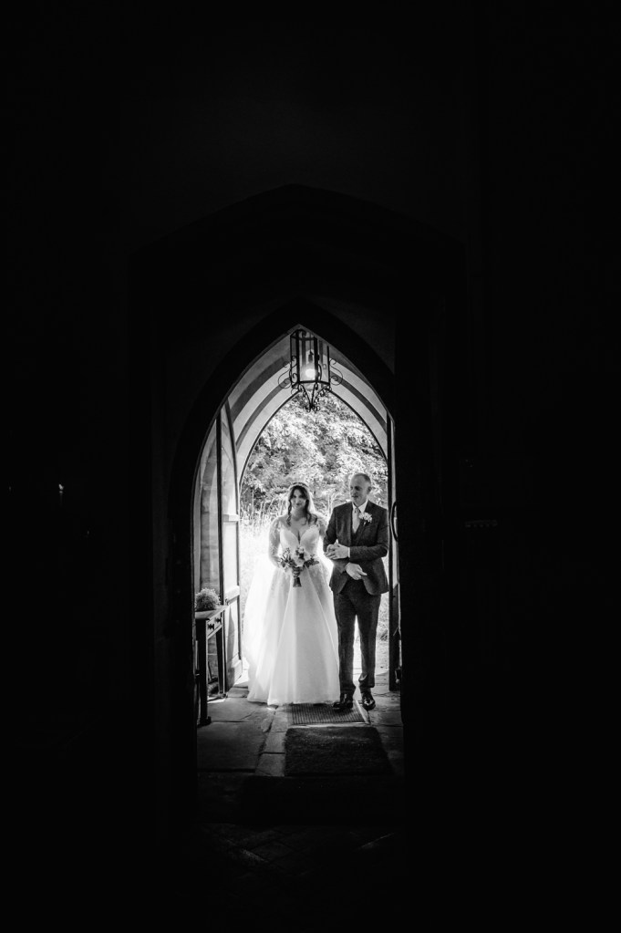 bride and dad  church door silhouette