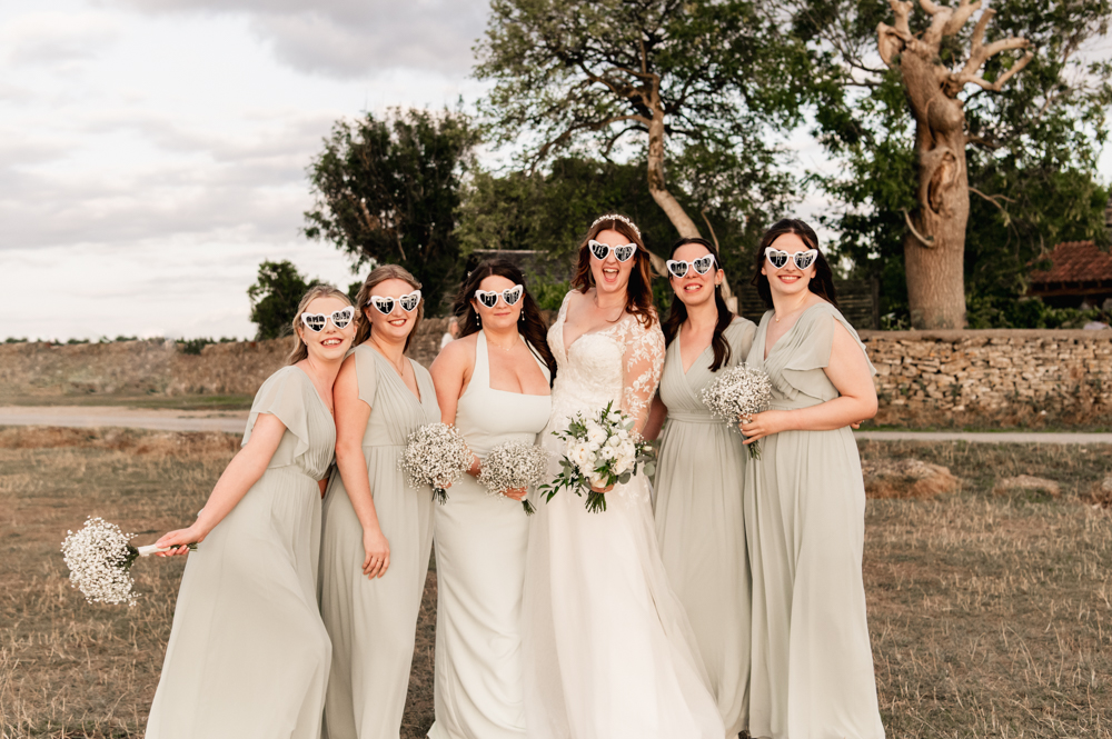 bride and bridesmaids fun shot sunglasses