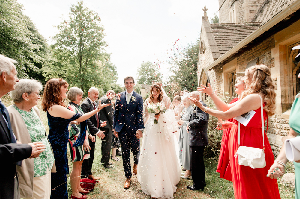 bride and groom confetti exit church