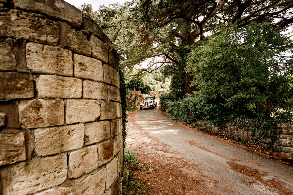 wedding car on a cotswold country lane
