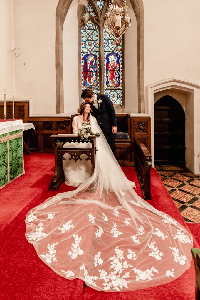 bride with a long veil church wedding