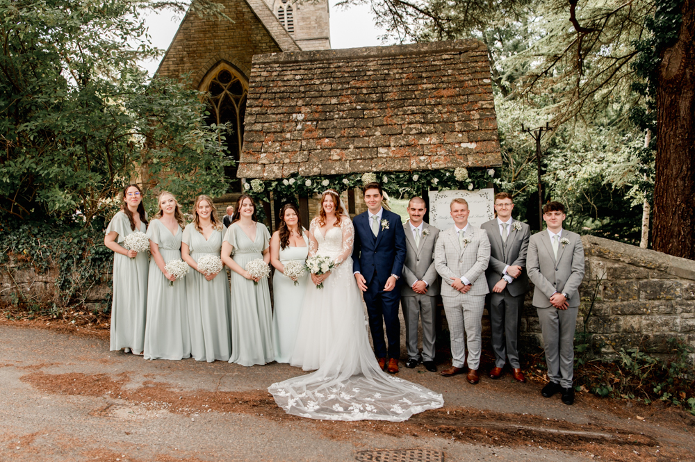 bridesmaids and groomsmen group shot church